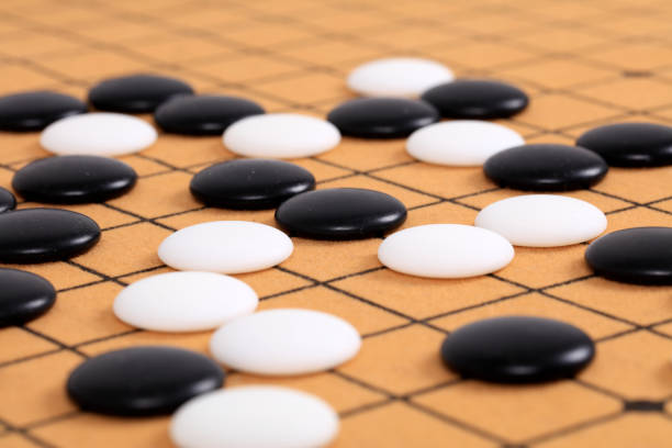 istock chinese game go,  Gobang and go game board 1365935486