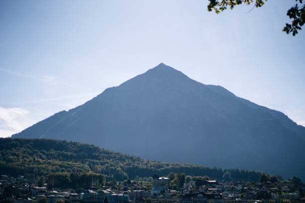 istock Mountain rises above town 1365938660