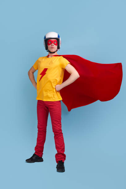 istock Brave superhero man in costume and helmet 1365941086