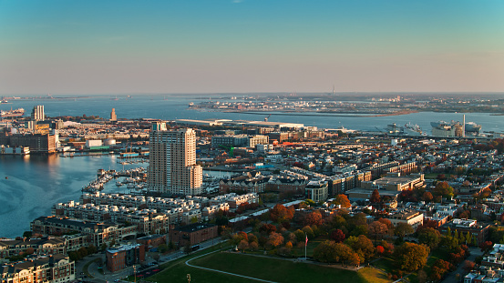 Aerial shot of Baltimore, Maryland at sunset, looking over Federal Hill Park and over Riverside towards Locust Point and the port. \n   \nAuthorization was obtained from the FAA for this operation in restricted airspace.