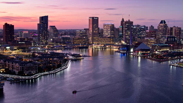 istock Boat Crossing Inner Harbor at Dusk in Baltimore - Aerial 1365953234