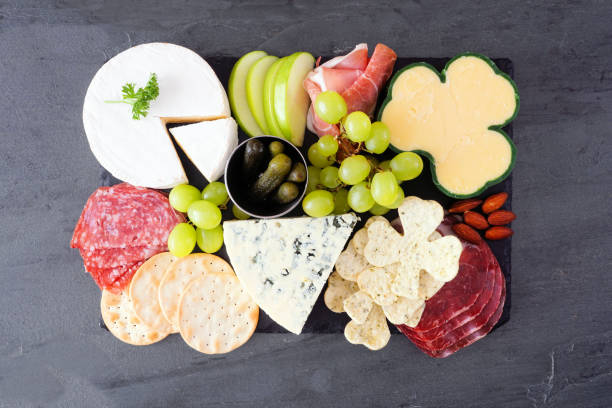 istock St Patricks Day charcuterie board, above view against dark slate 1365953535