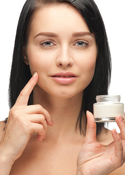 istock Beautiful woman applying moisturizing cream 136595703
