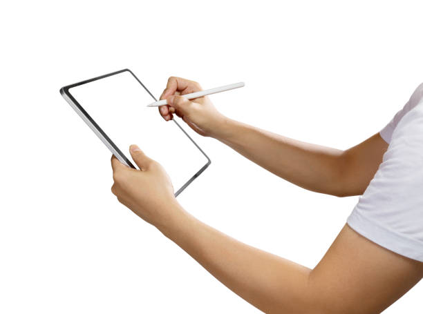 istock Side view of hand holding a mockup tablet and pencil with blank screen isolated on white 1365967611