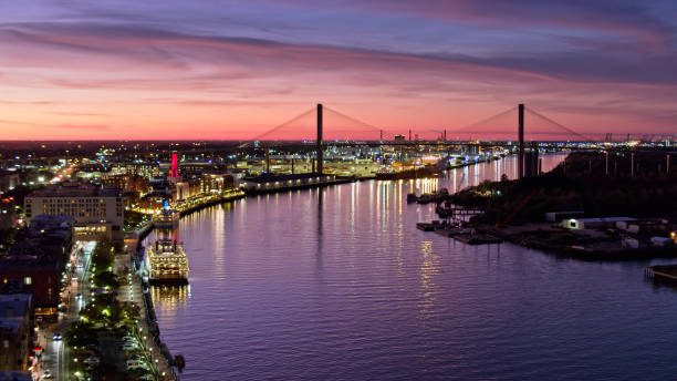 istock Talmadge Bridge and Savannah Riverfront at Dusk - Aerial 1365968424