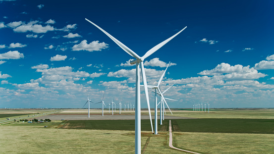 Drone shot of a massive wind farm on agricultural land in Oldham County, Texas, near the town of Everett.