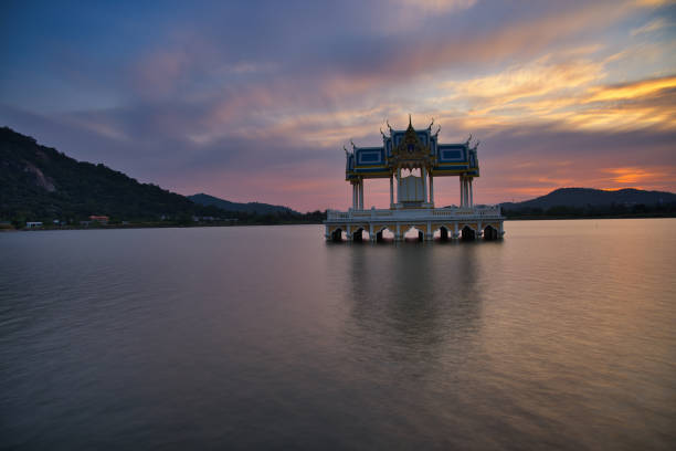 istock Buddhist Shrine On A Lake At Sunset! 1365969645