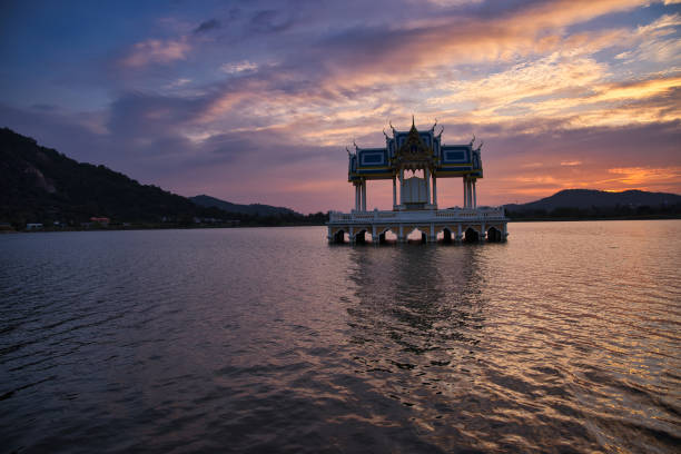 istock Buddhist Shrine On A Lake At Sunset! 1365969652