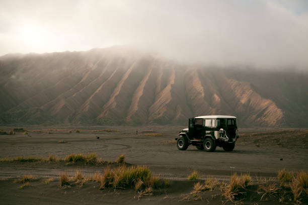 Mount Bromo Caldera Off road vehicle on the volcanic caldera at Mount Bromo. bromo tengger semeru national park stock pictures, royalty-free photos & images