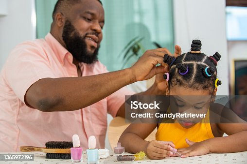 https://media.istockphoto.com/id/1365972196/photo/african-father-tying-little-daughter-hair-with-colorful-hair-band-in-living-room.jpg?s=170667a&w=is&k=20&c=7HNL5Xyr__2z7BOl42628txU4AtaGt6juWXEJPGXcTc=