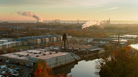 Aerial shot of industrial buildings on the bank of the Delaware River in Wilmington, Delaware at sunrise on a Fall morning. 

Authorization was obtained from the FAA for this operation in restricted airspace.