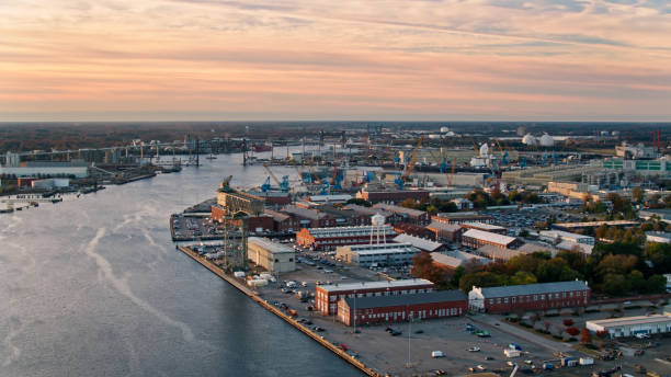 istock Drone Flight Over Naval Shipyard on the Waterfront in Norfolk, VA at Sunrise 1365973018