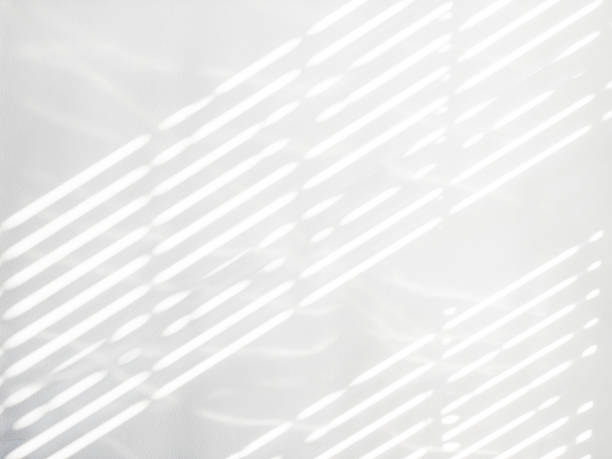 istock Lights shadows. Abstract light, black shadow overlay from window on white texture wall. Sunlight architecture background. Textures Light reflection from the window. 1365975446