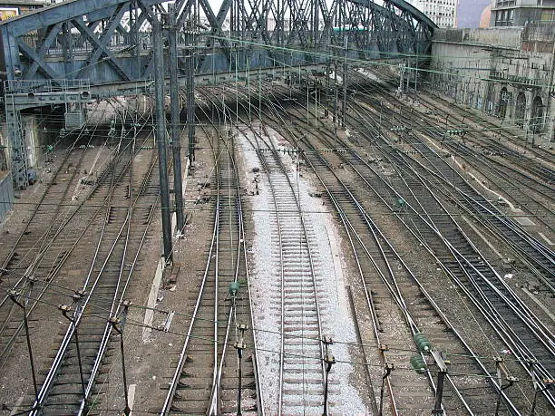 Railway tracks near Paris railwaystation. Taken from Rue Phillipe de Girard looking towards the Rue de l' Aqueduc. Lots of tracks and overhead lines.