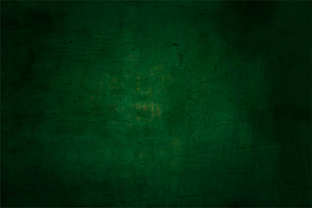 Dark emerald green coloured textured blemished, empty, blank horizontal vector backgrounds with glow in the middle Very dark green color slate texture blotched horizontal vector backgrounds. The illustration has No text and No people but copy space all over. It has a vignette with dark corners. green wall stock illustrations