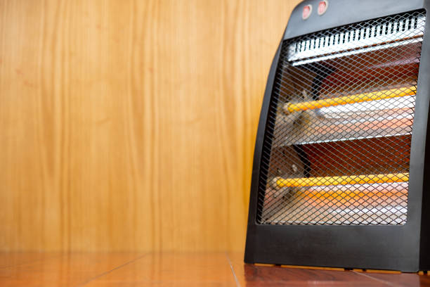 istock electric heater on a wooden floor 1365981878