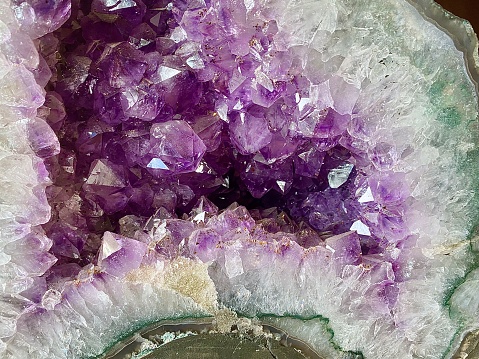 Pile of Raw Rose quartz stone textured surface background. Selective Focus Center Front.