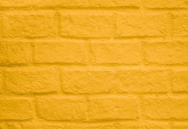 istock Abstract weathered texture stained old stucco light clean color and aged paint concrete orange brick wall background 1365983661
