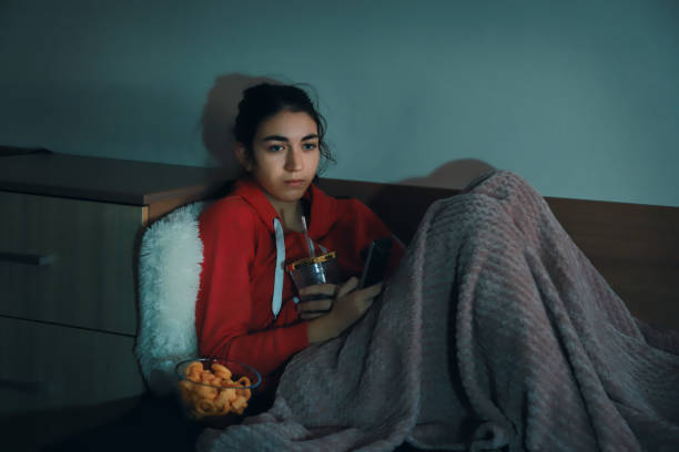 istock Girl watching TV 1365983951