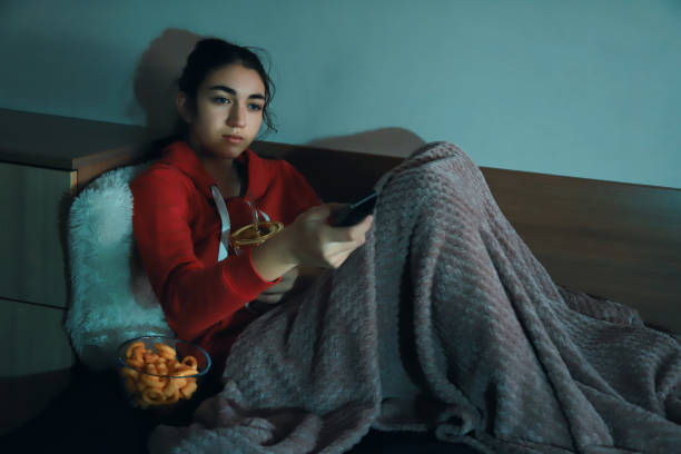 istock Girl watching TV 1365983954