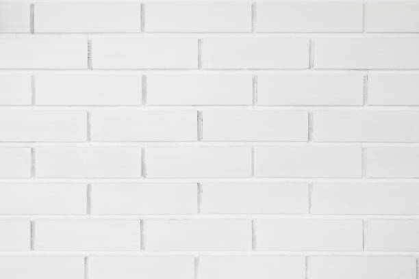 istock Abstract weathered texture stained old stucco light clean color and aged paint concrete white brick wall background 1365983960