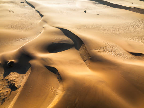 istock Shadows covering the red dunes early morning from above 1365984000