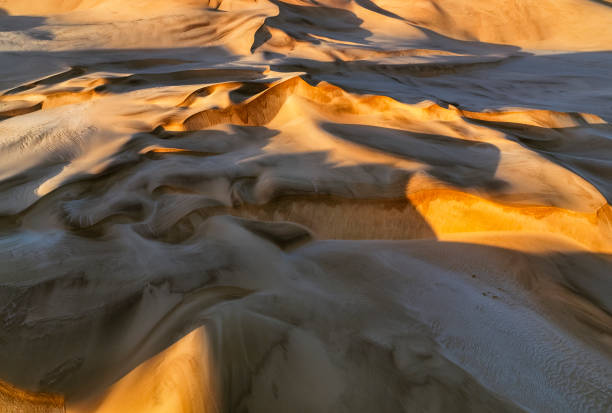 Morning sunlight and shadows on desert dunes