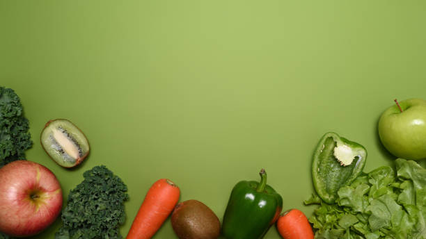 istock Fresh vegetables on green background with copy space. Healthy food concept. 1365984242