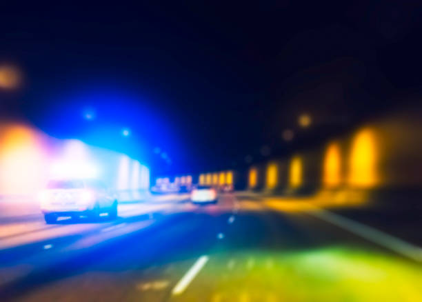 istock police car with lighting while  running in tunnel. 1365986007