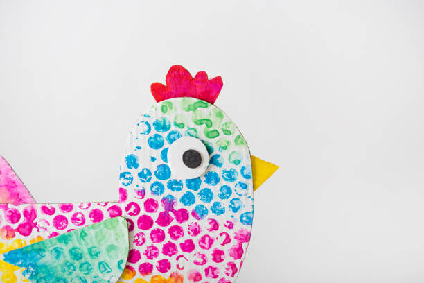 istock chicken made of cardboard - egg stand. easter decor. craft for kids. white background with copy space 1365986186