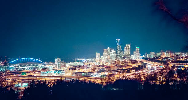 istock seatte city scape with freeway at night,Washington,usa. 1365988697