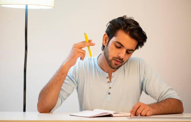 istock young man working from home using laptop stock images 1365989527