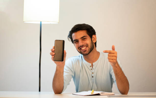 istock young man working from home using laptop stock images 1365989597