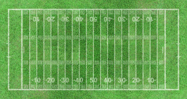 istock American football field, stripe grass with white pattern lines. Top view 1365989783