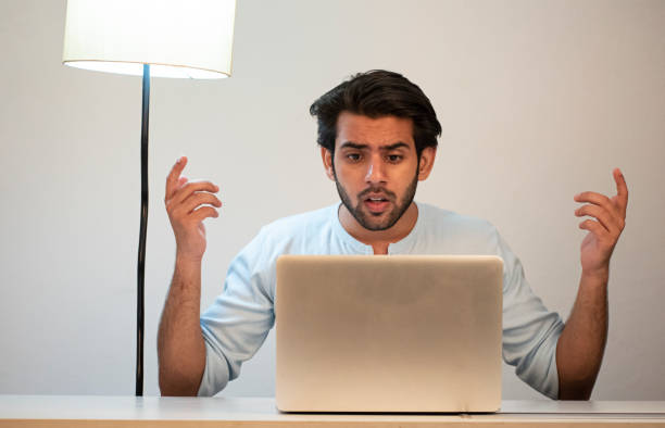 istock young man working from home using laptop stock images 1365989883
