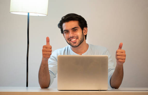 istock young man working from home using laptop stock images 1365989893