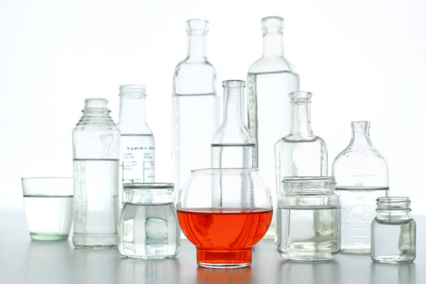 istock Bottles and cups of colored water 1365991893