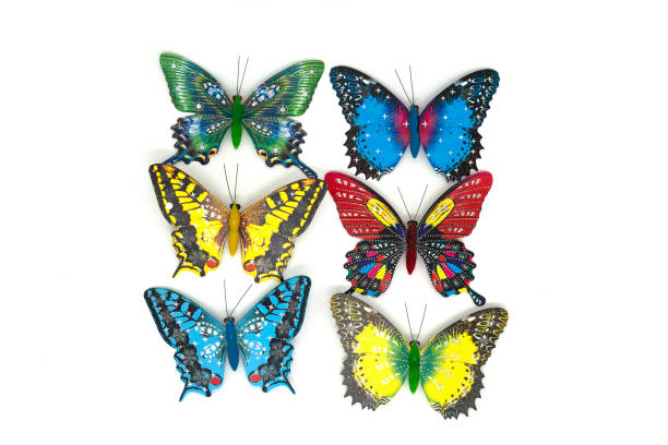 istock Close-up of plastic colored toy butterfly isolated on white. 1365993469