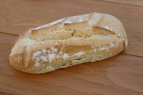 istock Crusty italian Ciabatta bread on wooden table 1365994365