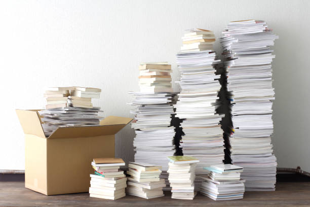 Disposal of many books, magazines and paperback books stock photo