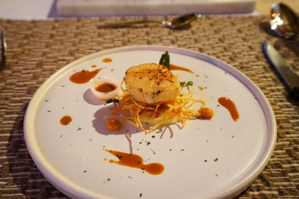 istock Close up pan seared Scallops with sauce 1365995573