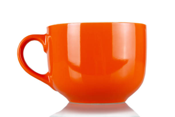 istock Beautiful big orange cup isolated on white 1365998018