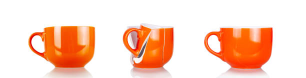 istock Concept of no return. Whole orange cup, broken cup and glued together isolated on white 1365998081