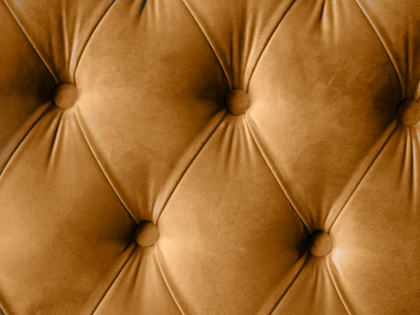 istock Velour lime surface of sofa close-up. Training equipment-velour mats tightened with buttons. brown chesterfield style quilted upholstery background 1365998250