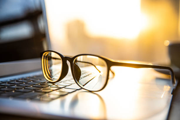 istock Eyeglasses on laptop with sunlight 1365999249