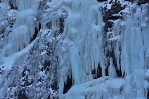 istock ice waterfall in dolomites mountains, Sappada Italy 1365999580