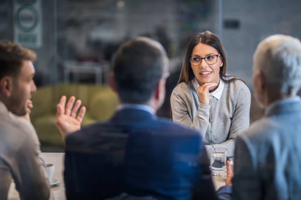istock Happy female candidate talking to human resource team on a job interview. 1365999621