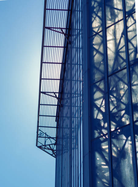 istock Building facade with blue sky. Glass wall in modern architecture. 1365999834