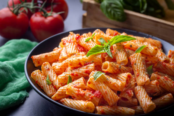 istock Penne pasta with tomato sauce 1366000558