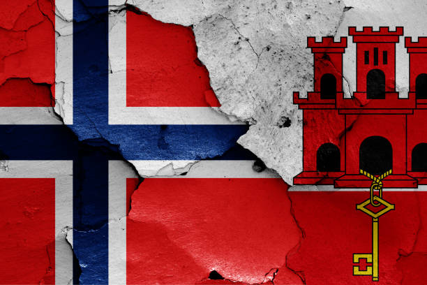 istock flags of Norway and Gibraltar painted on cracked wall 1366001177